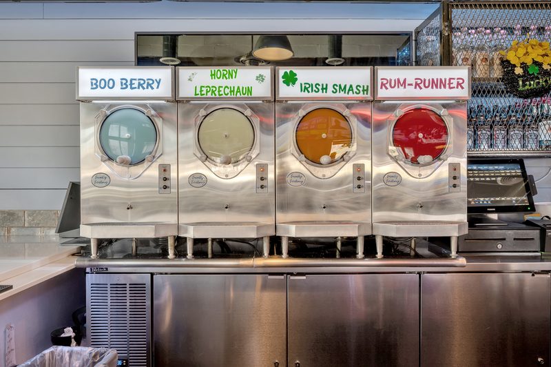 Four frozen cocktail machines labeled Boo Berry, Horny Leprechaun, Irish Smash and Rum-Runner